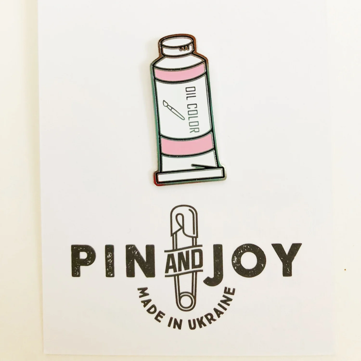 ЗНАЧОК ТЮБИК КРАСКИ РОЗОВЫЙ