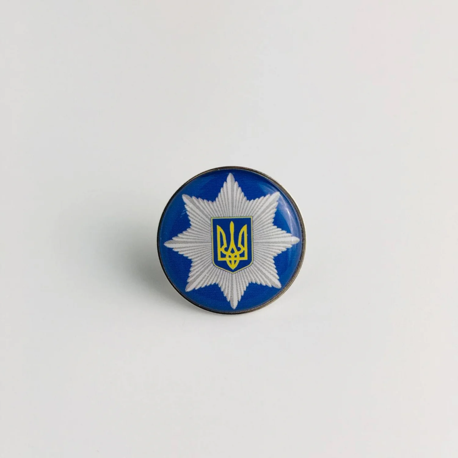 Значок Емблема Національної поліції (коло)