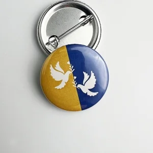 Значок закатной Голуби на флаге